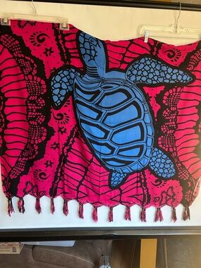 DECORATIVE SARONG OR BEACH COVER-UP BLUE TURTLE MOTIF ON PINK & BLACK BACKGROUND